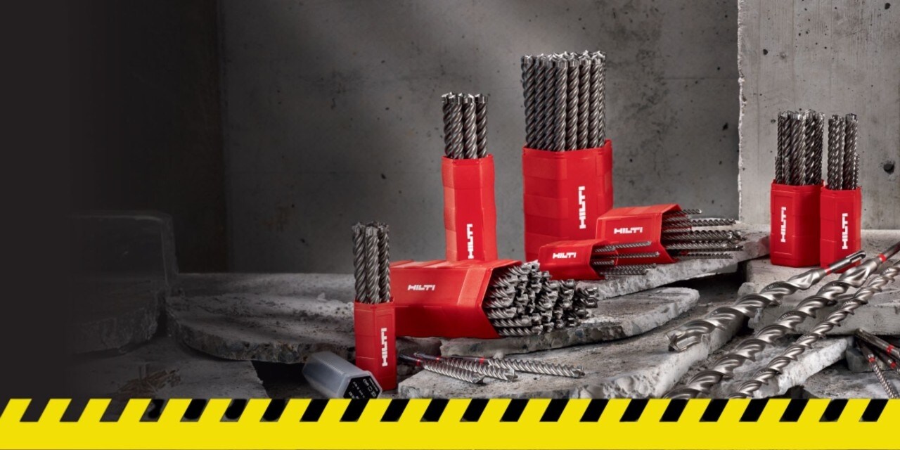 red drill bit on a red and yellow back ground